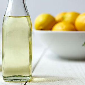 Lemon Oil with a bowl of lemons